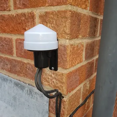Dusk-to-dawn photocell for outdoor lighting, one of our electrical projects in Leicestershire