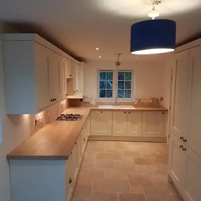 Kitchen with under-cabinet LEDs and a statement pendant, one of our electrical projects in Leicestershire